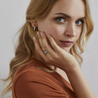 minimal twist rose gold stainless steel huggie earrings